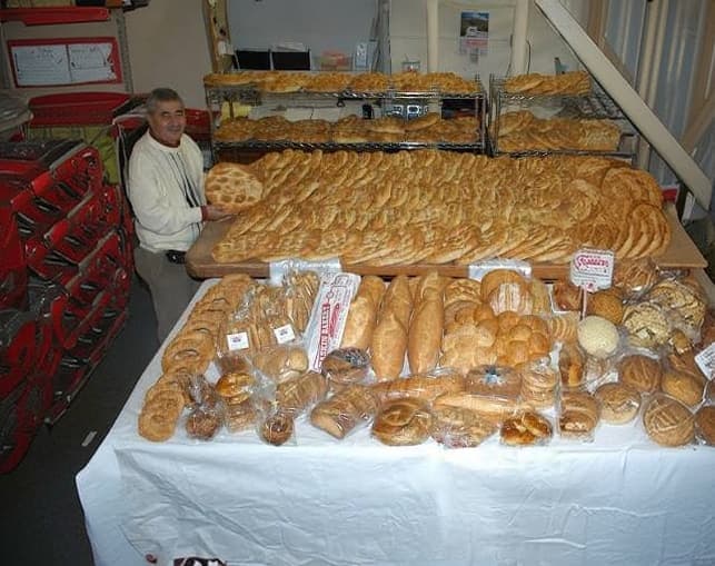 Historic bakery interior lined with fresh bread